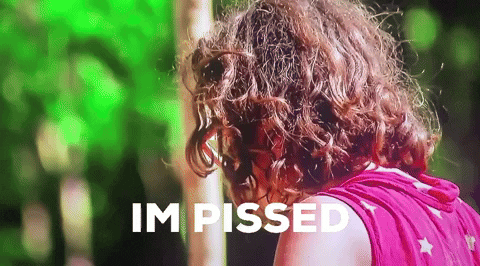 A person turning around slowly and then screaming, I'M PISSED