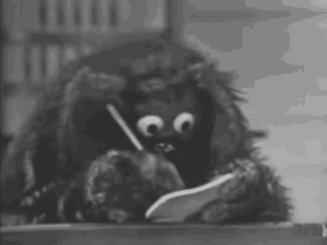 Muppet Rowlf writing