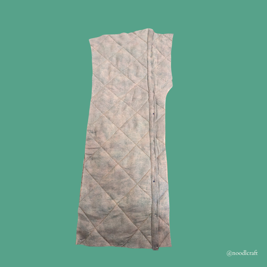 A view of the inside of the jacket with a bias-bound flat-felled seam, which will enable the jacket to be reversible.