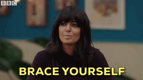 A woman with black hair and the words BRACE YOURSELF