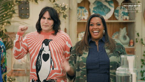 Noel Fielding raising his hand and Alison Hammond saying 'yes!' and celebrating
