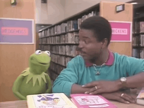 Kermit the Frog nods while talking to Levar Burton