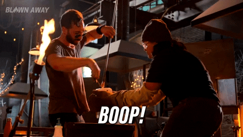 Two people working in a factory with a flame nearby, and the word "Boop!"