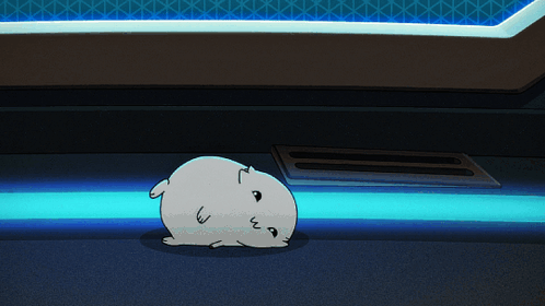 A cute white animal rolls around and then plops into a hole in the ground