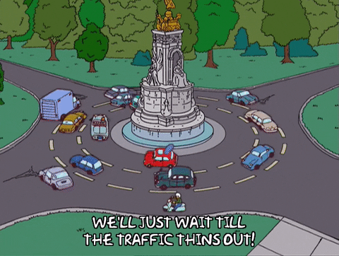 Cars circling a monument on The Simpsons; "We'll just wait till the traffic thins out!"