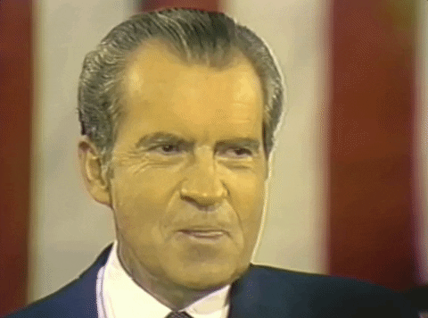 Richard Nixon licking his lips in an awkward way